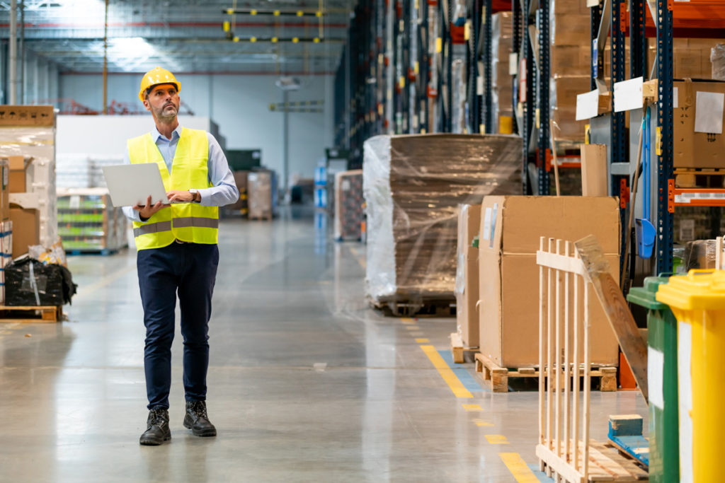 A worker walking through a customs warehouse in El Paso.
